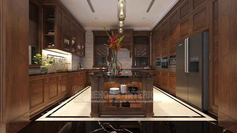 Tủ bếp chữ L gỗ óc chó được thiết kế một cách linh hoạt và khéo léo, kết hợp bàn bàn đảo được đặt ở chính giữa tạo sự bề thế, sang trọng cũng như đẳng cấp của chủ nhân ngôi nhà